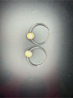 Silver hoop earrings with pearl accent